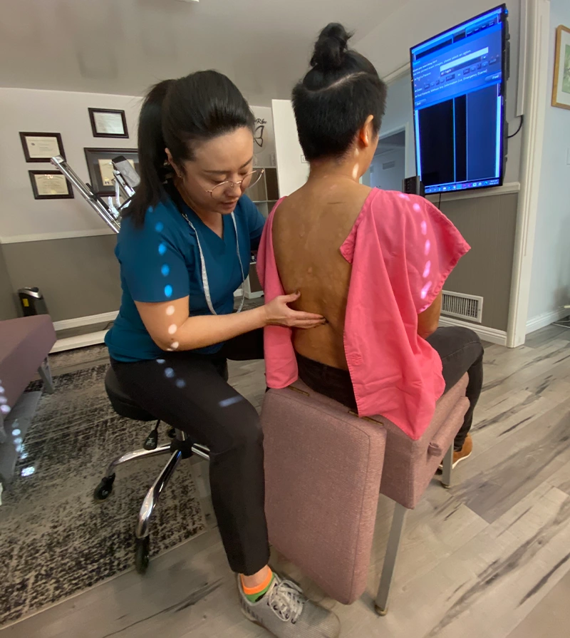 Chiropractor Las Vegas NV Justine Rhee With Patient